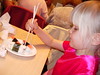 Elena eating sushi and battling the chopsticks