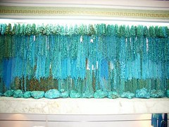 About one quarter of the turquoise wall